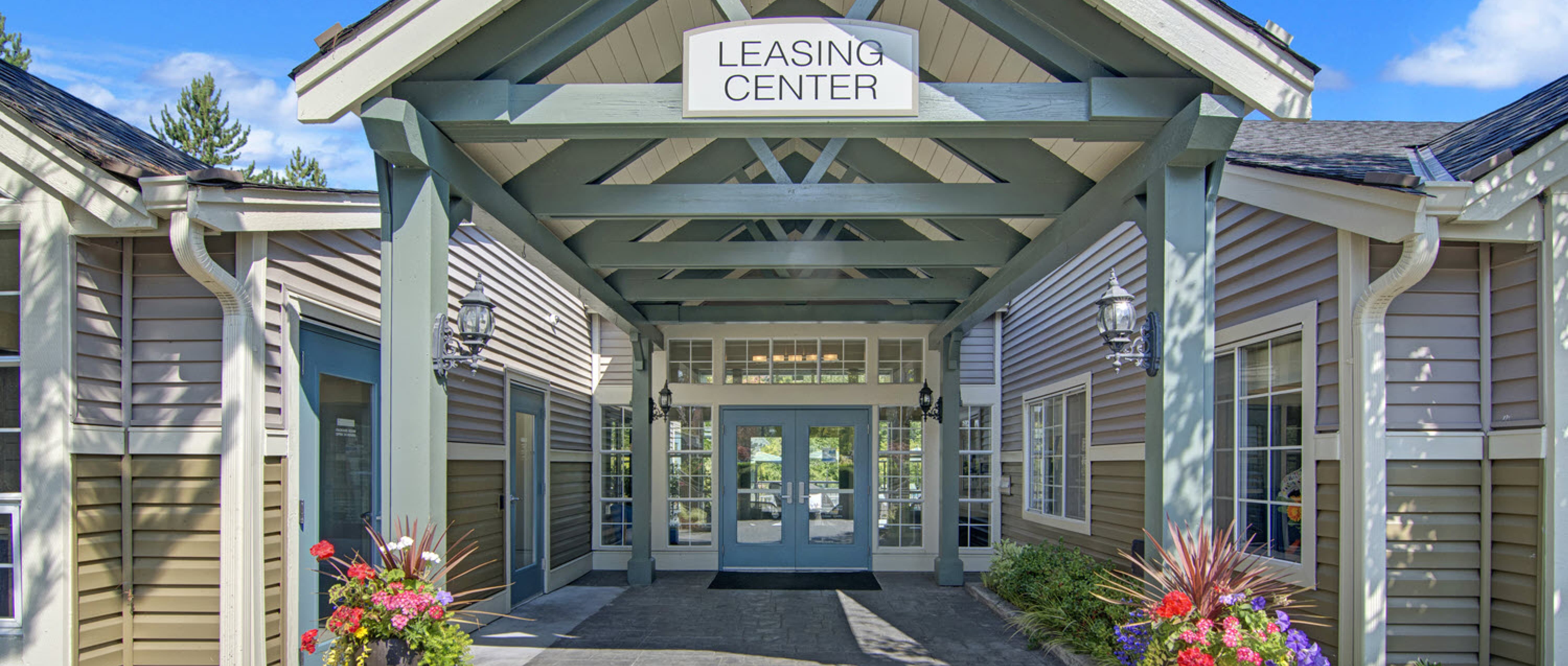 Front leasing office doors at On the Green at Harbour Pointe Apartments